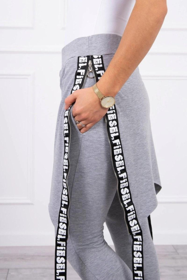 Kalhoty à la overal s ramínkem s nápisem Self šedé